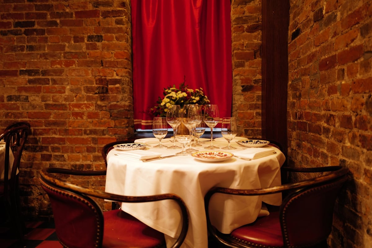 Elegant fine-dining restaurant interior with warm ambient lighting
